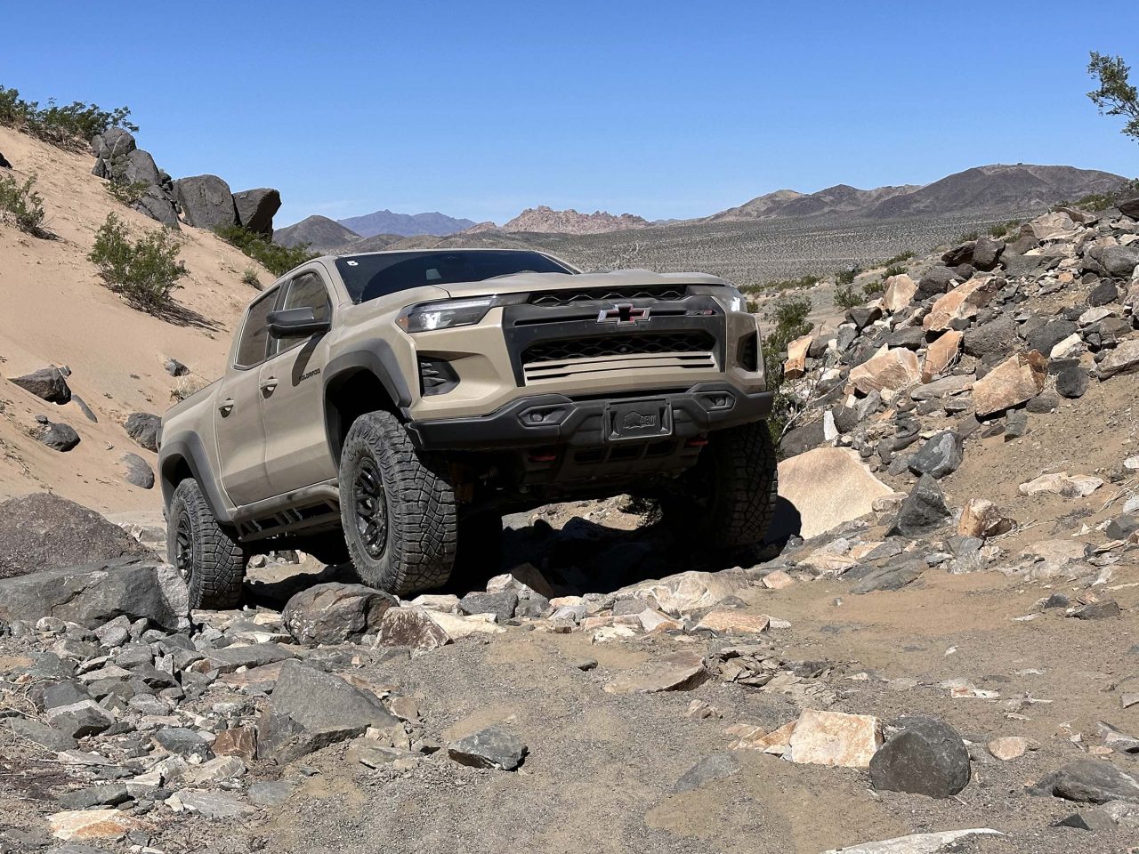 First Drive 2024 Chevrolet Colorado ZR2 Bison Headlight News   2024 Chevrolet Colorado ZR2 Bison Beauty Shot Cresting Boulders 1280x960 