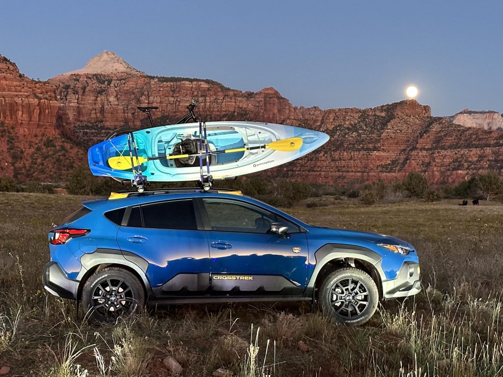 2024 Subaru Crosstrek Wilderness - w kayak mountains and moon at night