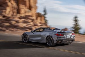 2024 Chevrolet Corvette E-Ray driving rear REL