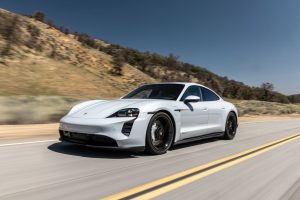 2024 Porsche Taycan ice grey driving REL