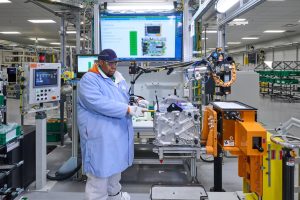 GM Honda FCSM worker assembles fuel cell system REL