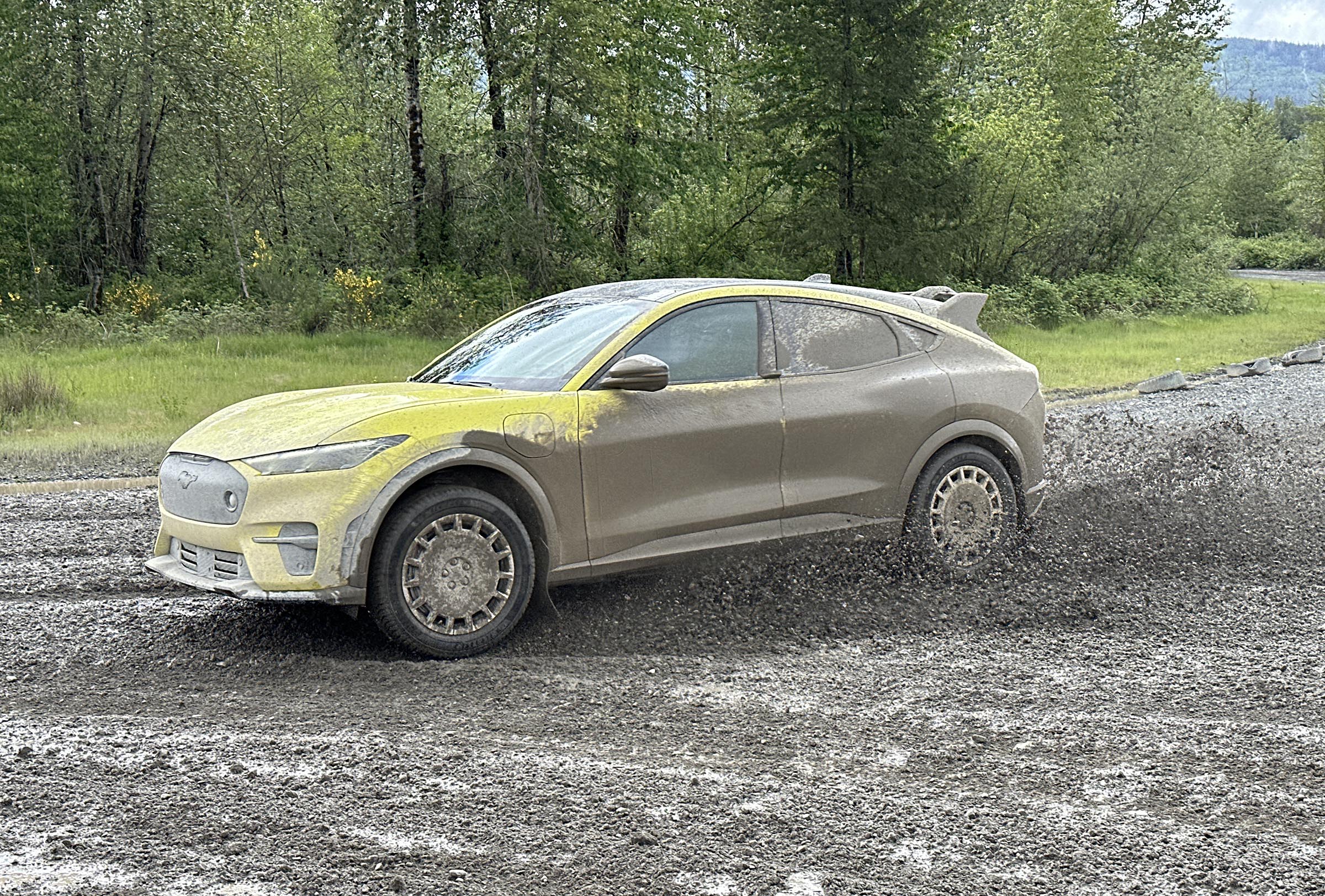 2024 Ford Mustang Mach-E Rally - yellow in muddy slide on track
