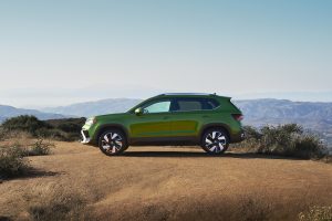 2025 VW Taos side green REL