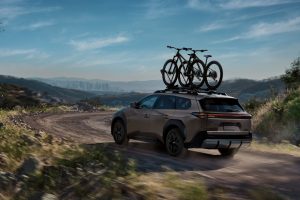 2026 Toyota bZ Woodland driving rear REL