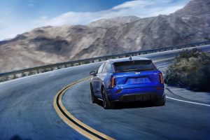 2026 Cadillac Optiq-V - rear 3-4 driving