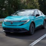 2026 Nissan Leaf - front 3-4 driving hero shot