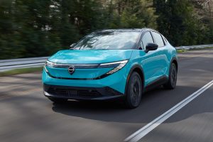 2026 Nissan Leaf - front 3-4 driving hero shot