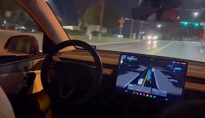 Tesla robotaxi at night
