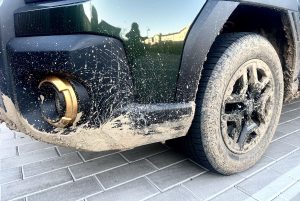 2026 Subaru Outback Wilderness - muddy rear wheel