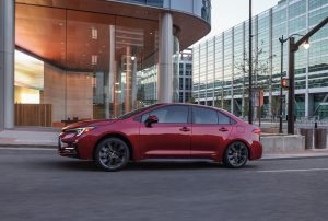 2026 Toyota Corolla Hybrid SE AWD side driving REL