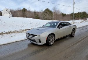 2026 Dodge Charger RT - Sedan on back road front 3-4