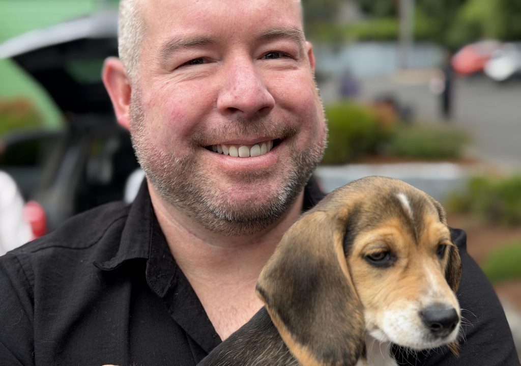 Operation Frodo EV - Smiling New Owner w Puppy