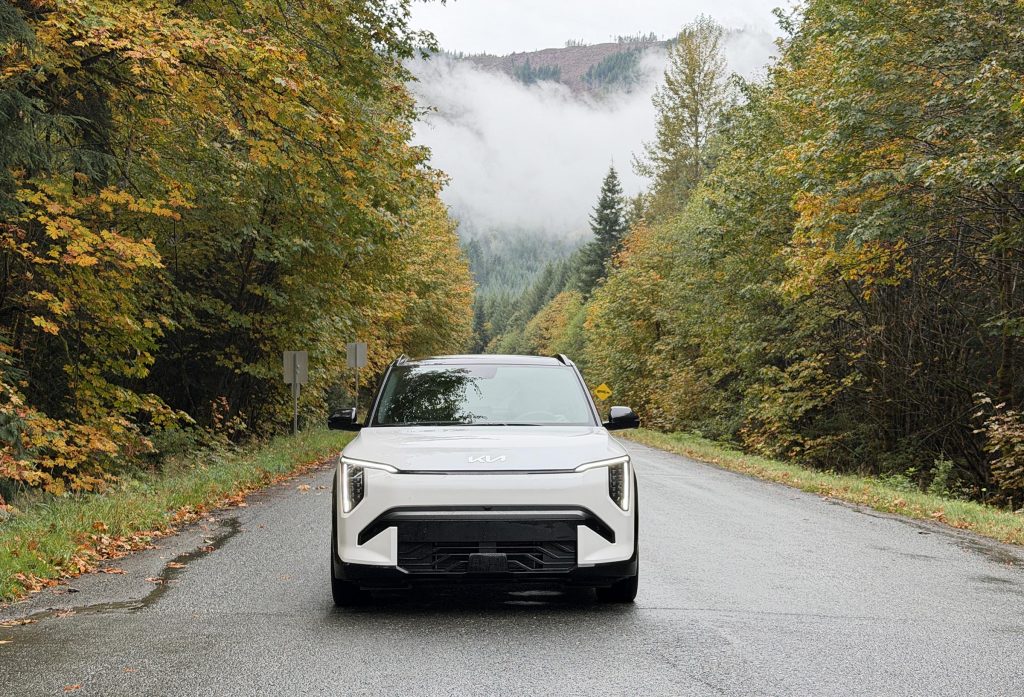 2027 Kia EV3 - front driving hero shot w clouds